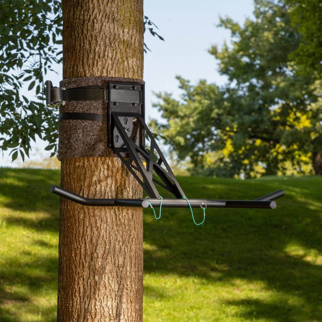 Pull up bar attached to tree outlet